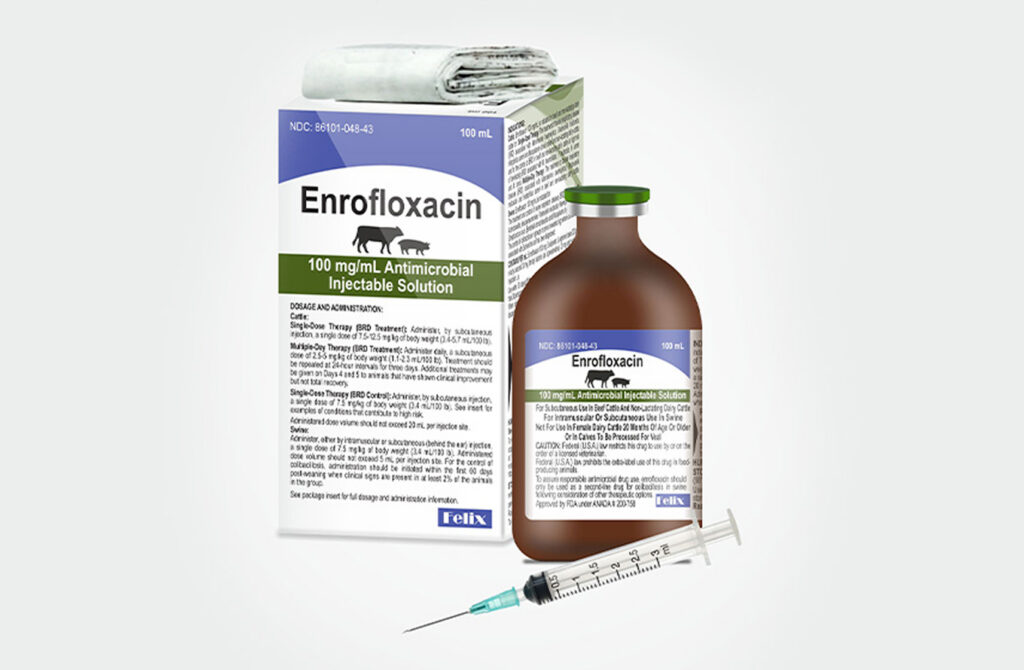 A product box and bottle of Enrofloxacin Antimicrobial Injectable Solution 10% for cattle and swine, with a syringe in the foreground.