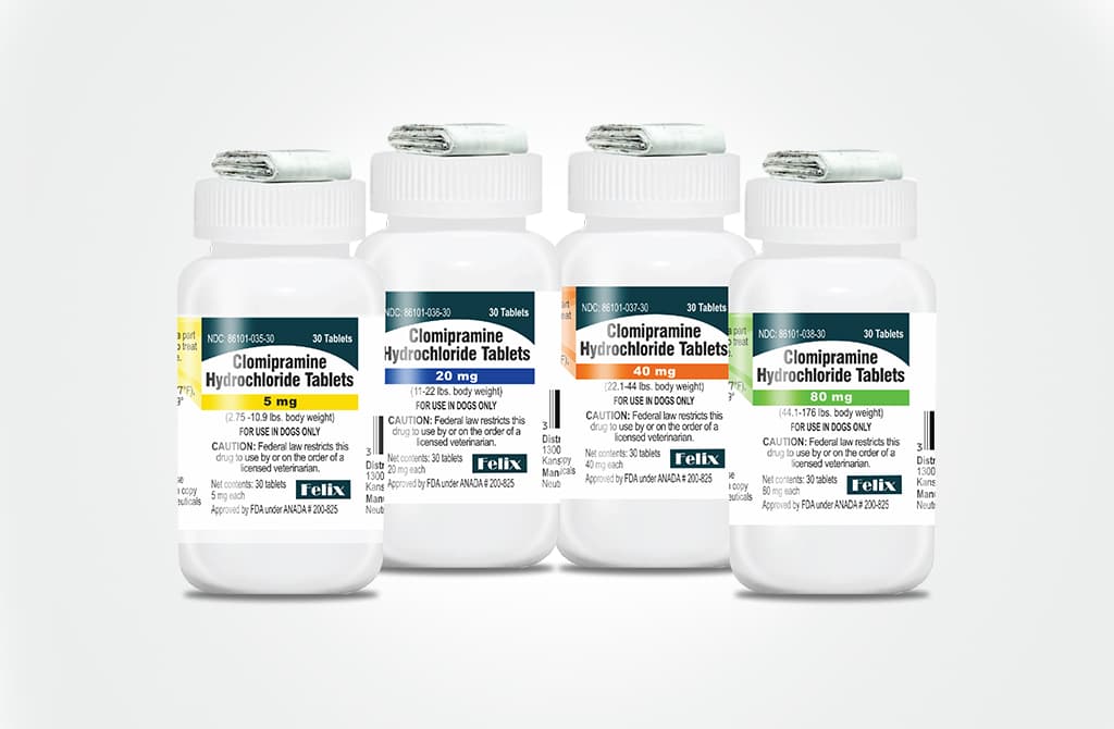 Four white bottles of Clomipramine Hydrochloride Tablets for dogs, lined up to show different dosage strengths of 5 mg, 20 mg, 40 mg and 80 mg.