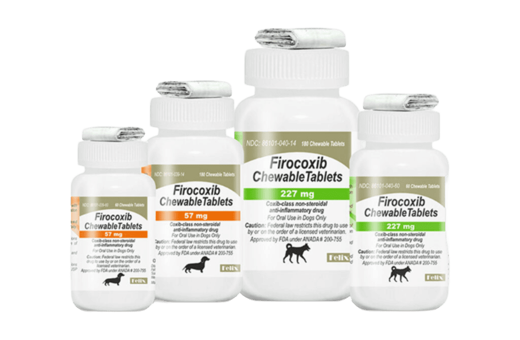 Four white plastic prescription bottles of Firocoxib Chewable Tablets for dogs in 227 mg and 57 mg strengths.